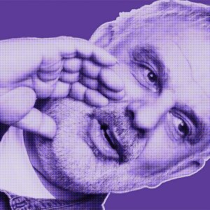 Purple-filtered portrait of Ferdinando from DAVID Systems holding his right hand to the side of his head