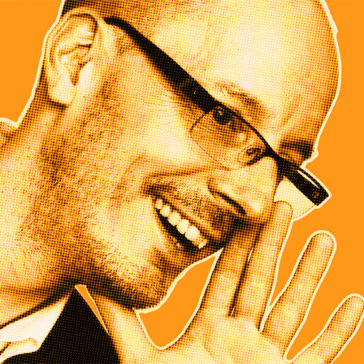 Orange-filtered portrait of Michael B. smiling and holding his hand to his mouth